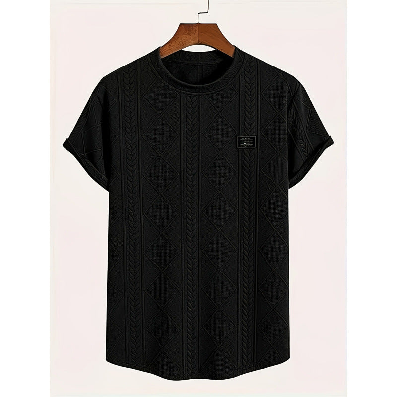 Close-up of geometric embroidery detail on polyester tee