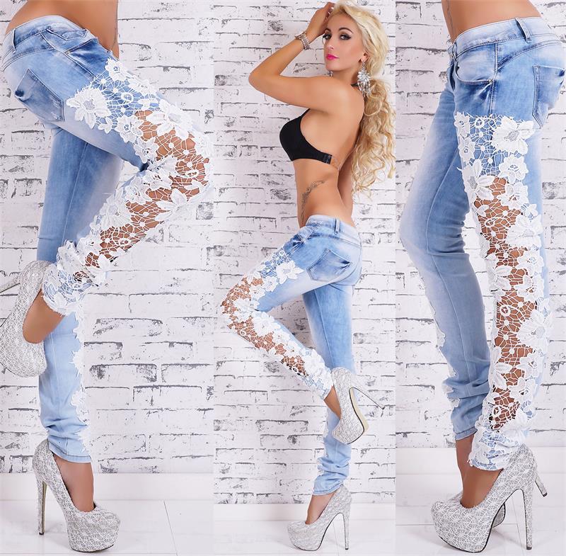 Close-up of lace trim on dark denim jeans
