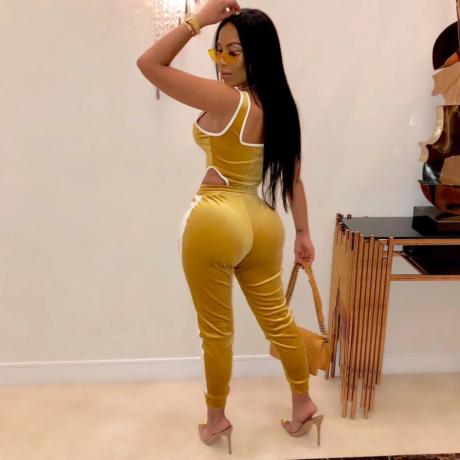 Gold color women’s sports set for gym and fitness